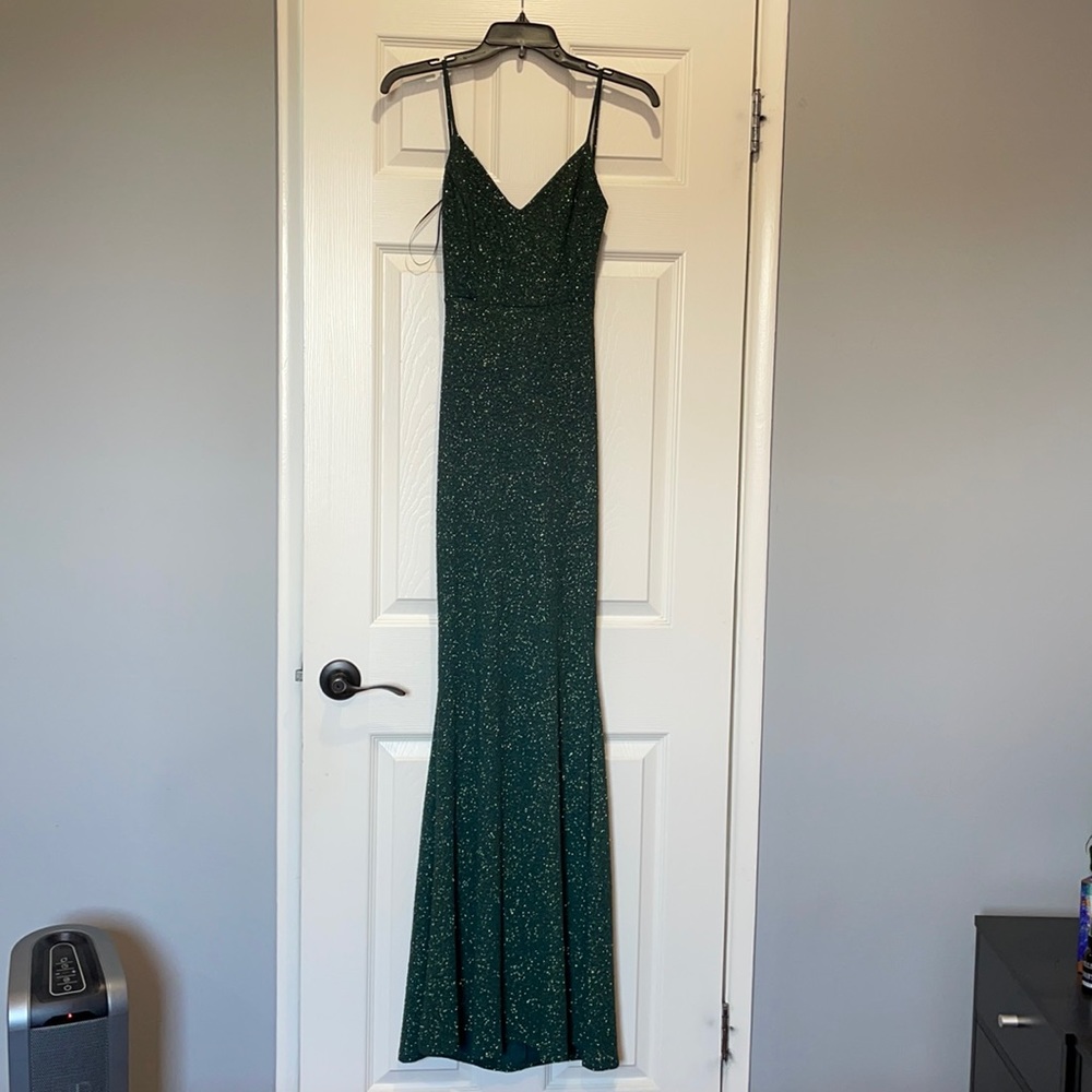 Emerald green glitter gown with open back